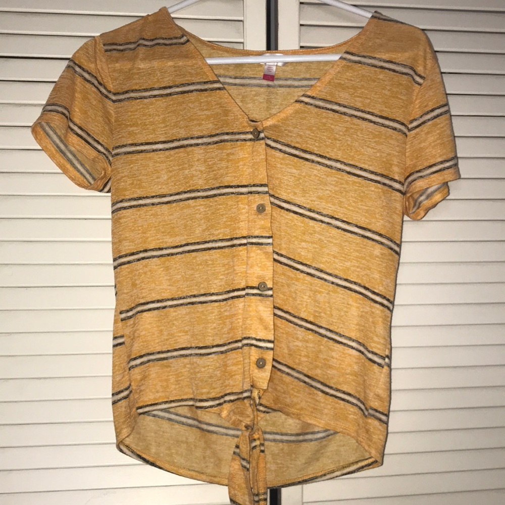 woman’s yellow striped blouse